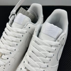White Nike Air Force 1 sneakers pair, open collar with laces and heel pull tab