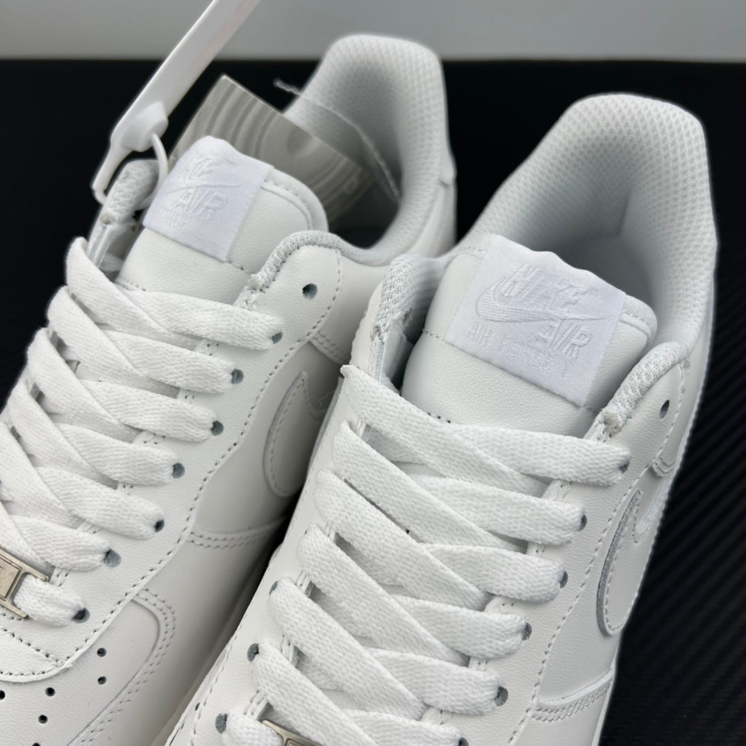 White Nike Air Force 1 sneakers pair, open collar with laces and heel pull tab