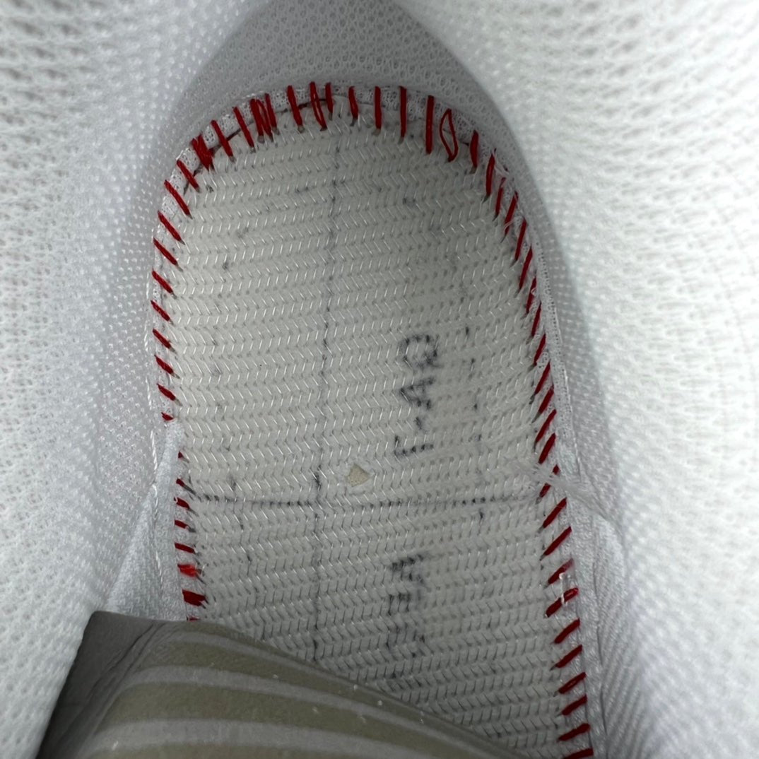 White Nike Air Force 1 interior lining with stitched panels and red edging