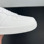White Nike Air Force 1 front side, perforated toe and lace-up sole