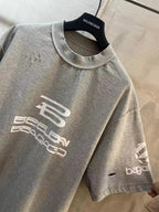 Light gray T-shirt with front logo graphic and short sleeves