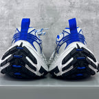 Back view of white and blue chunky sneakers with black and blue tread outsole
