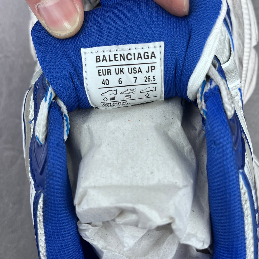Balenciaga size label inside blue tongue on white and blue chunky sneakers