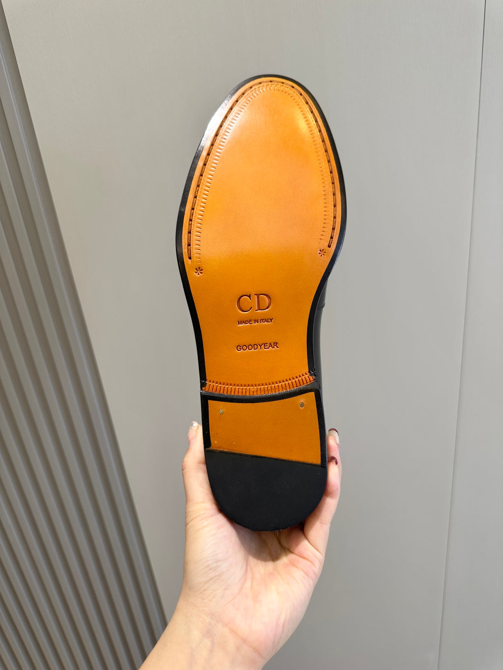 Dior unisex loafer outsole, amber leather with CD and Goodyear marks