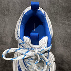 Unisex sneaker interior showing blue insole and Balenciaga logo on heel