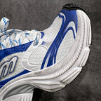 Unisex sneaker side close-up in white and blue with textured panels and thick sole