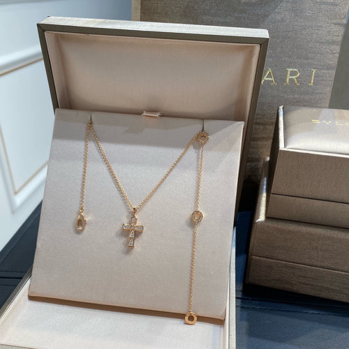 Bvlgari cross necklace and drop earrings set in gold tone with pavé stones
