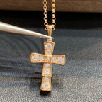 Bvlgari gold-tone cross pendant with clear pavé stones on a chain