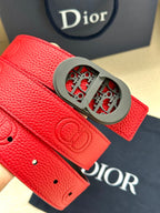 Red leather Dior belt close-up with gray oval buckle and embossed monogram on strap.