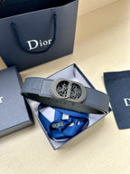 Dior belt on box with oval logo buckle and blue leather strap