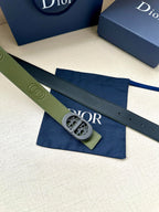 Green leather Dior belt with oval logo buckle and stitched perforation holes