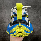 Balenciaga unisex sneakers, heel view, neon yellow webbing strap and blue/black cushioning
