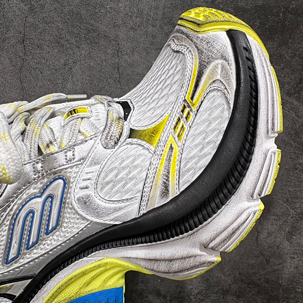 Balenciaga unisex sneakers, side close-up, silver leather with blue logo and neon yellow piping