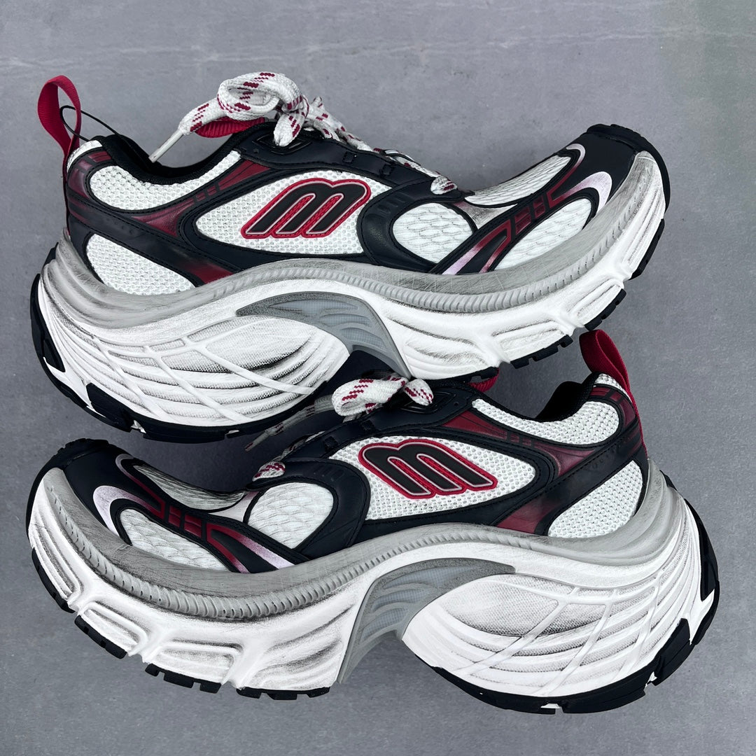 Balenciaga unisex chunky sneakers angled side view, black, white, and red logo