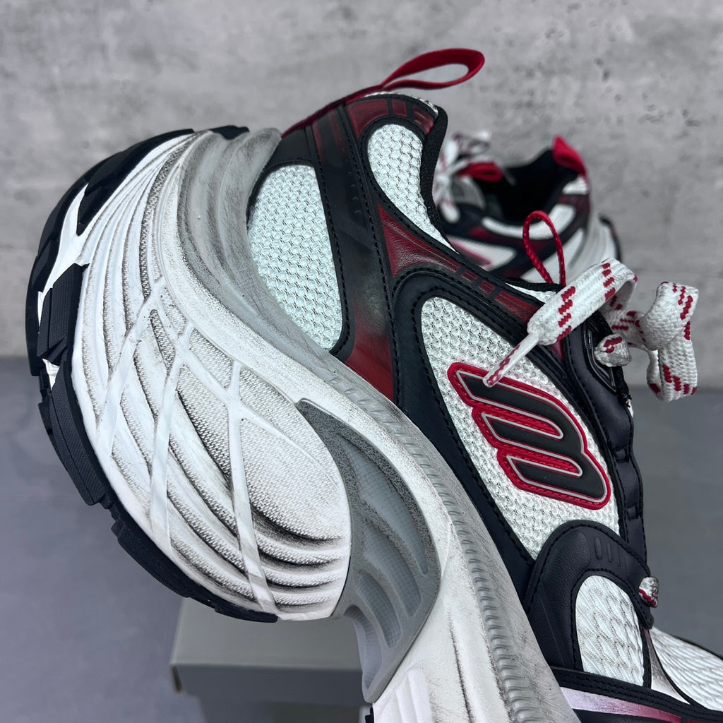 Balenciaga unisex chunky sneakers side profile with red trim and textured white midsole