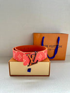 Louis Vuitton belt with red monogram strap and large metal LV buckle