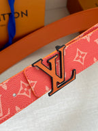 Louis Vuitton belt detail: pink monogram strap with large LV buckle
