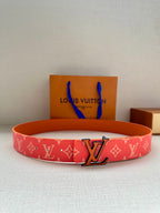 Louis Vuitton belt with red monogram strap and large metal LV buckle