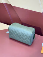 Louis Vuitton monogram zip pouch, light blue, angled view with zipper pull