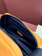 Interior view of mustard leather bag with navy lining and zip pocket