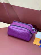 Louis Vuitton purple embossed crossbody bag with zip closure and shoulder strap