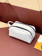 Louis Vuitton pouch bag in white with navy striped trim and top zipper