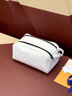 Louis Vuitton pouch bag with white monogram leather and navy zip trim