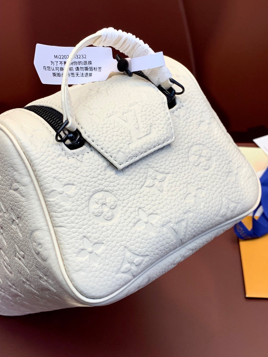 Louis Vuitton mini bag with white monogram leather and top handle straps