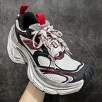 Balenciaga chunky sneakers, front 3/4: black, white mesh, red laces