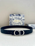 Dior belt, dark navy fabric strap with silver-tone CD buckle and small eyelets.