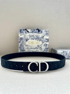 Dior belt, dark navy fabric strap with silver-tone CD buckle and small eyelets.