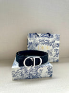 Dior belt in dark navy with silver-tone CD buckle and perforated strap holes.