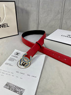 Chanel belt red strap with black underside and blue-gold logo buckle, on packaging