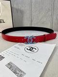 Chanel belt with red leather strap and black underside, oval logo buckle detail
