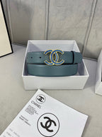 Chanel belt in light blue with CC buckle inside a square gift box