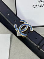 Black Chanel belt with blue jeweled CC buckle, detailed close-up