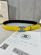 Chanel belt in bright yellow with blue CC-style buckle, black inner lining
