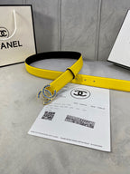 Chanel yellow belt with blue emblem buckle and black underside, with receipt card