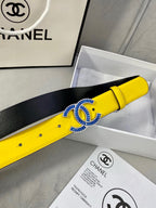 Chanel yellow belt with blue buckle detail, black underside visible beside box