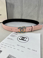 Chanel belt in pink leather with blue and gold CC-style buckle, black underside.