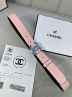 Chanel belt in pink leather with blue and gold CC-style buckle and punched holes.