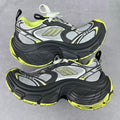 Chunky lace-up runner sneakers in gray, black, and neon yellow with logo panels
