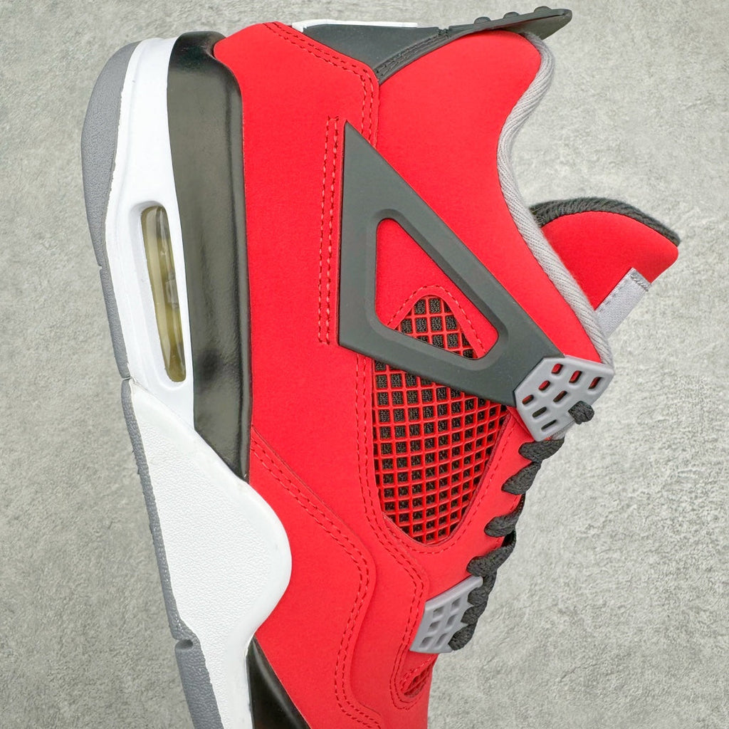 Red sneaker side view with gray wing detail, black mesh, and visible air sole unit