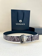 Versace floral belt with silver Medusa buckle on dark plum leather