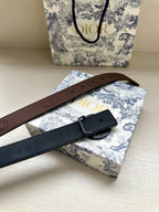 Dior belt with brown and dark blue straps, circular logo buckle and holes
