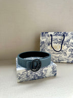 Dior belt with light blue strap and dark CD buckle, side view