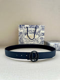 Dior belt in dark blue leather with small eyelets and oval logo buckle.
