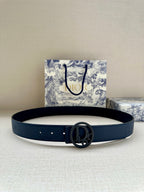 Dior belt in dark blue leather with small eyelets and oval logo buckle.