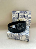 Navy leather belt with oval Dior logo buckle and embossed logo detail