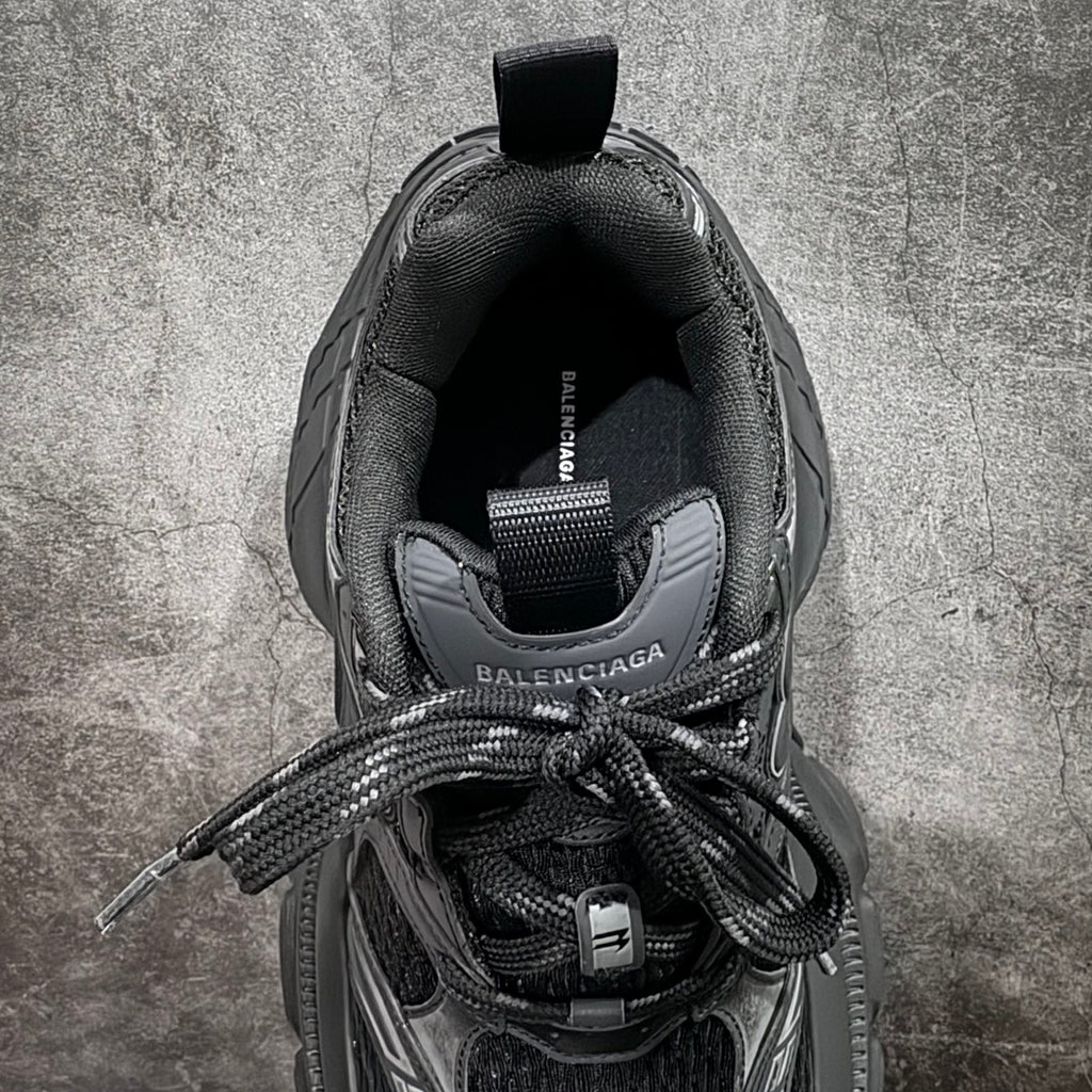 Balenciaga sneakers inside view, black insole with Balenciaga and size label